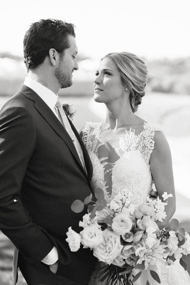 The bride and groom wed with a sage, peach and orange wedding at Omni Barton Creek Resort and Spa.