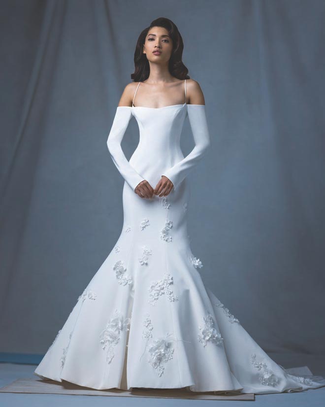 The bride wears an designer wedding gown by Ines di Santo featured in the Weddings in Houston Magazine. 