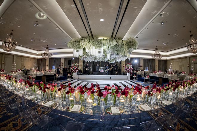 Magenta, burgundy and pink flowers decorate the New Year's Eve wedding at the Houstonian Hotel, Club and Spa. 