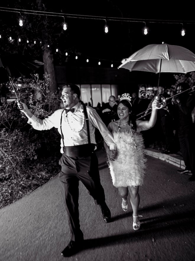 The bride and groom parade out of their New Year' Eve wedding at the Houstonian Hotel, Club & Spa. 