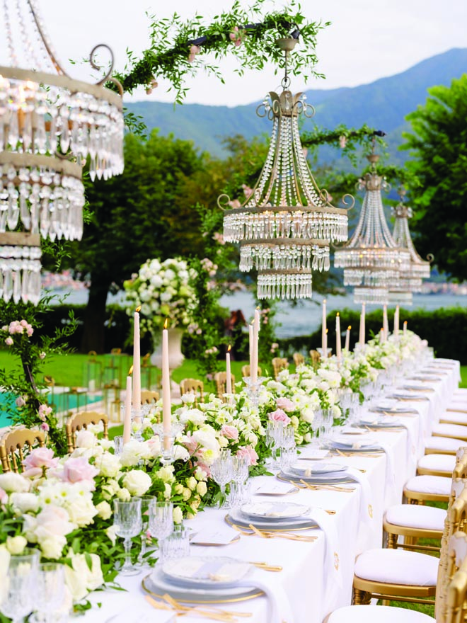Crystal chandeliers, blush florals and gold accents detail the al fresco wedding on Lake Como.