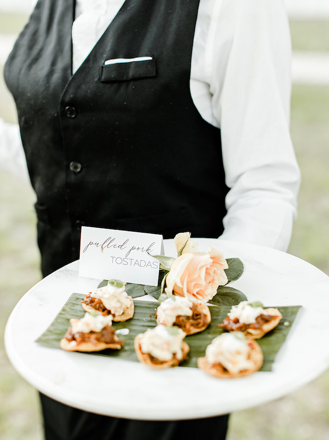 A wedding planning tip is to host a cocktail hour between your wedding ceremony and reception to entertain your guests.