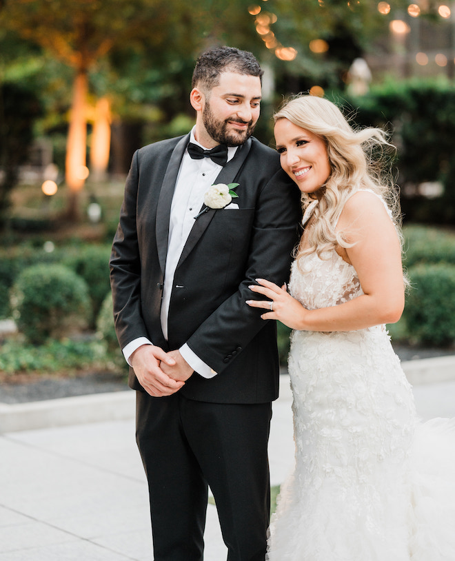 Bride and groom smiling at the C. Baldwin Hotel. 