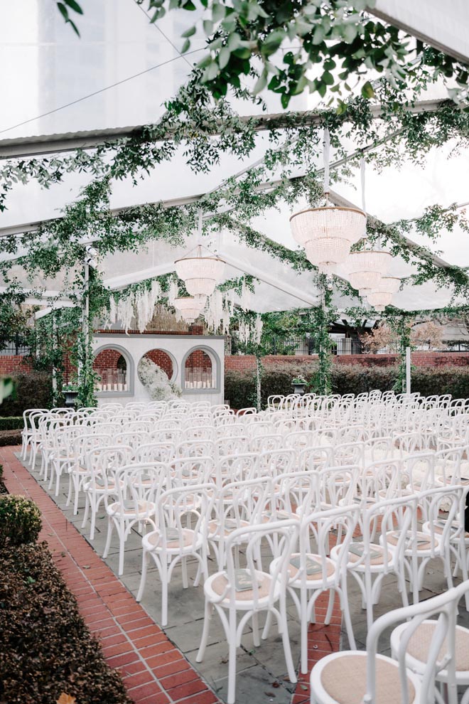 The bride and groom wed with an outdoor wedding ceremony in Houston.