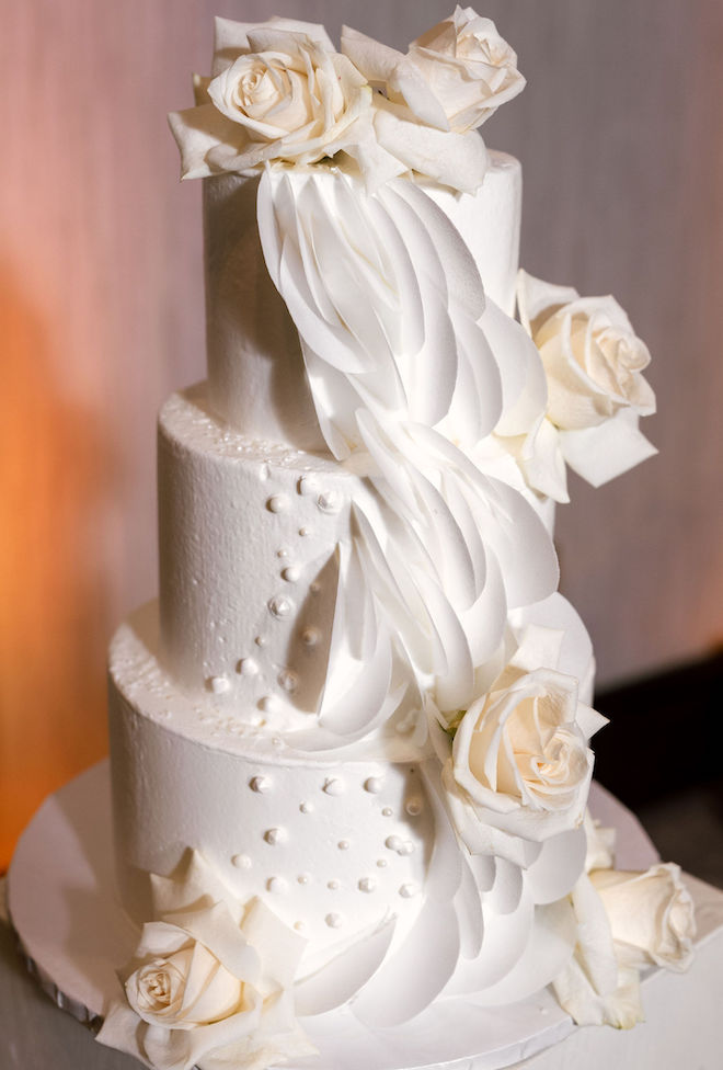 For Heaven's Cake designs and elegant wedding cake with texture and ivory colored roses. 