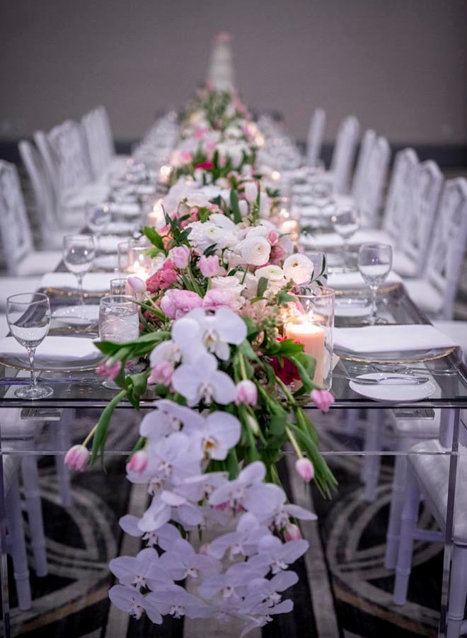 Plants N' Petals designs a floral arrangement table-runner for the pink and navy wedding in Houston. 