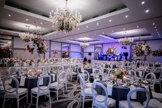 Pink and navy decor decorate the ballroom wedding at the Omni Houston Hotel. 