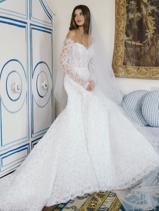 An all lace gown with a sweetheart neckline and lace long sleeves. 