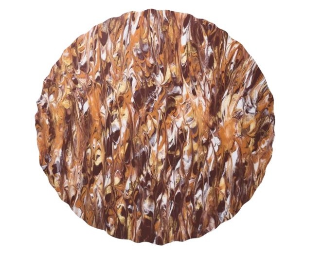 A textured marbled placemat in cranberry and orange color.