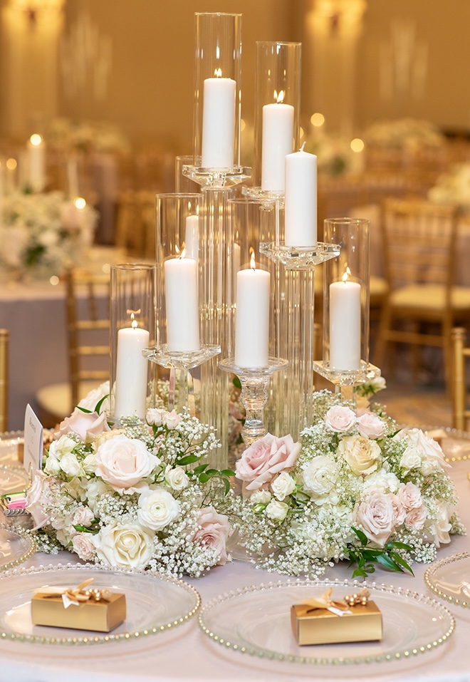 Pastel roses and candles decorate the ballroom wedding reception at The Houstonian Hotel, Club and Spa.
