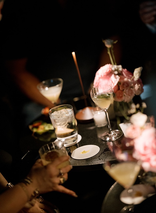 Wedding guests enjoy cocktails at the Houston restaurant wedding reception.