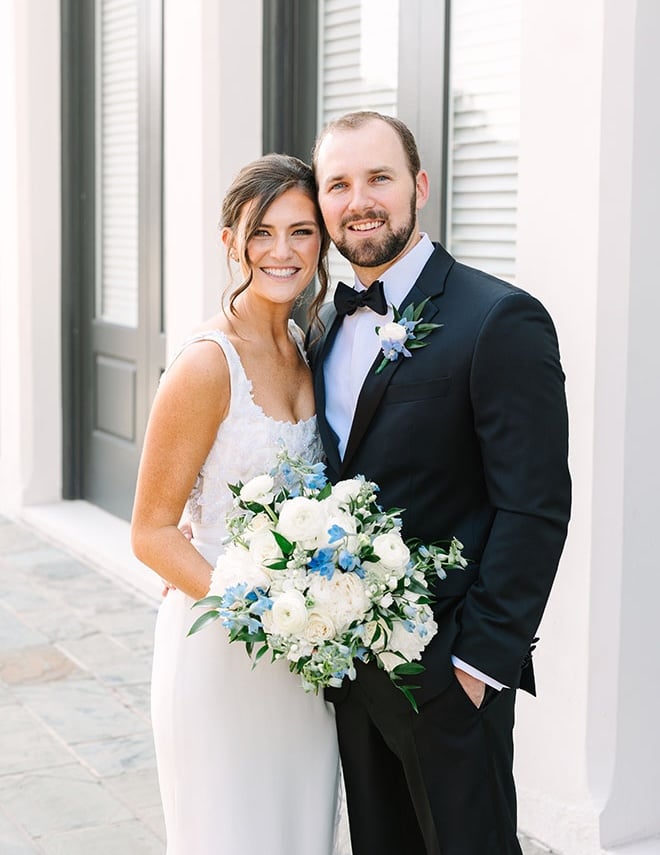 The bride and groom wed in a blue and white ballroom wedding in Galveston.