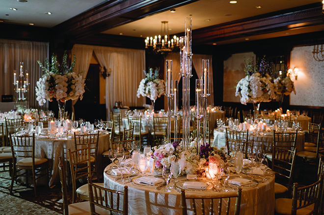 Candlelight and champagne and lavender decor decorate the reception tables.