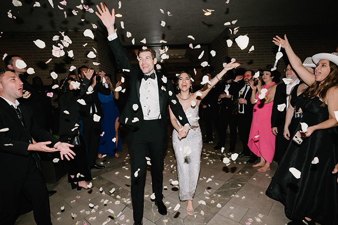 The newlyweds celebrate with a rose petal send off to conclude their Persian wedding in Houston.