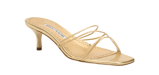 A gold strappy sandal with a short heel by Manolo Blahnik. 