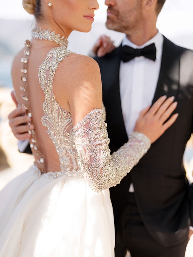 The bride wears a custom wedding gown by Michael Costello for her Italian elopement.