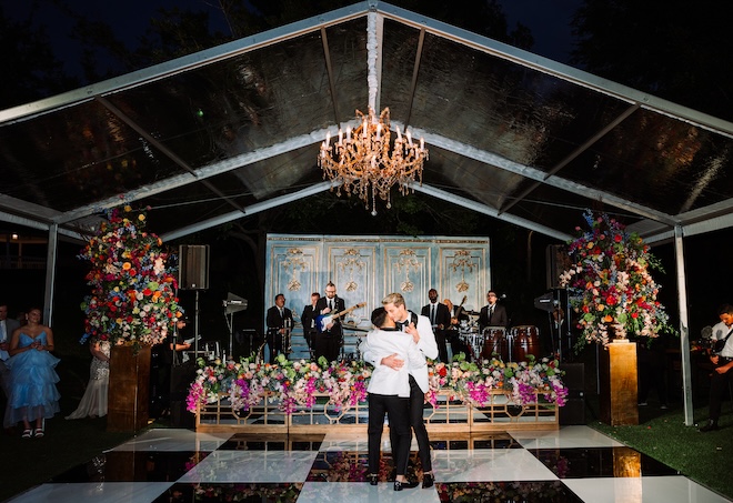 The groom's hugging during their first dance.
