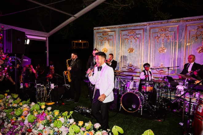 Ben singing on the reception stage. 