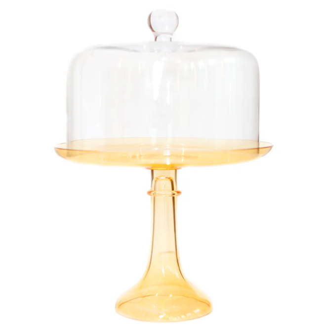 A clear cake dome with a yellow stand.