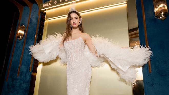 A barely-there beaded slip, draped in shimmering art-deco lines, with its feathered accent.