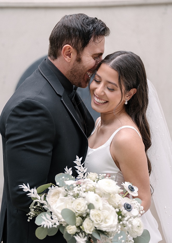 The couple share a sweet moment after their wedding ceremony. 