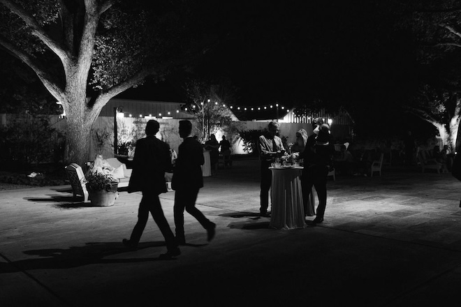 The outside of The Pattison House during cocktail hour, a country-chic Houston venue.