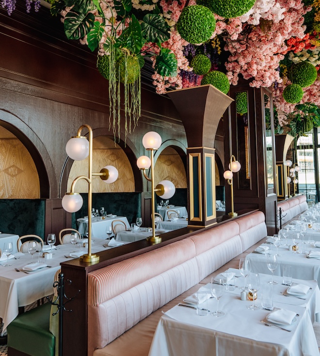 The interior of Annabelle Brasserie with florals hanging from the ceiling. 