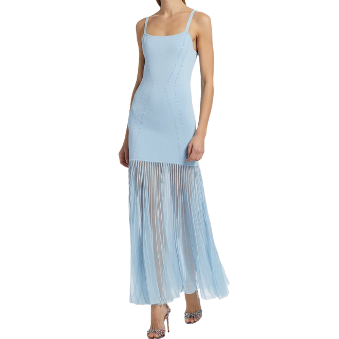 The model wears a light blue drop waist dress by Nicholas the Label.  
