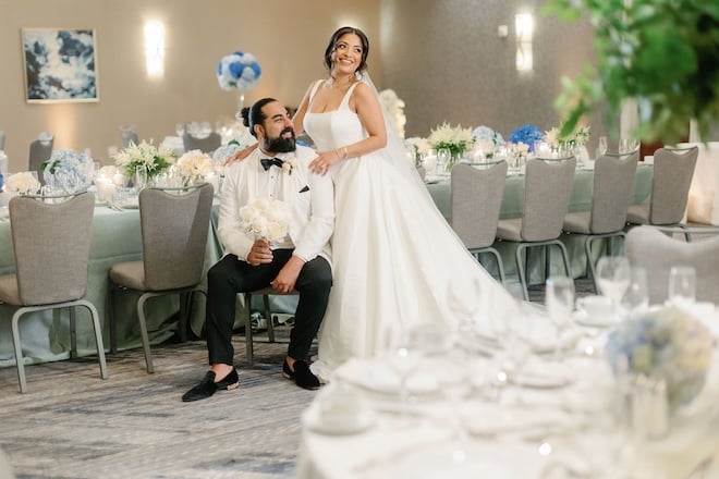 The bride and groom pose in the ballroom at the JW Marriott Houston by the Galleria. 