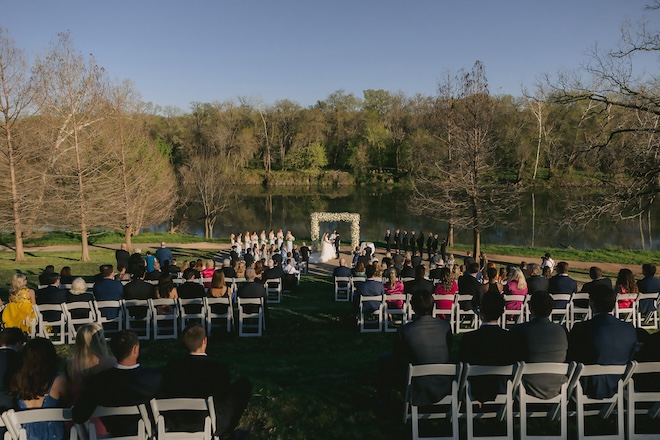 A wedding ceremony with the backdrop of the river at Hyatt Regency Lost Pines Resort & Spa. 