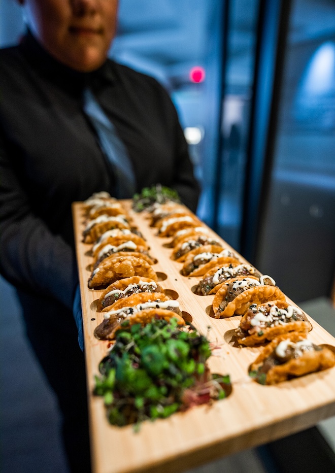Masraff's Catering and Restaurant serve mini tacos at an event Houston. 