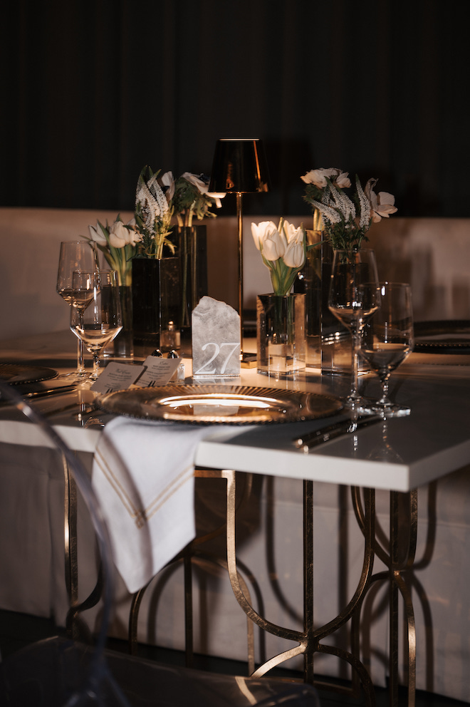 Reception table setting, green and white florals with some hints of gold and nude. 