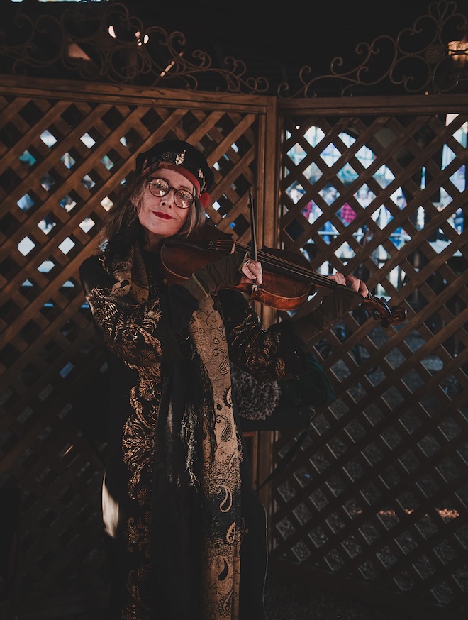 A woman playing the violin.