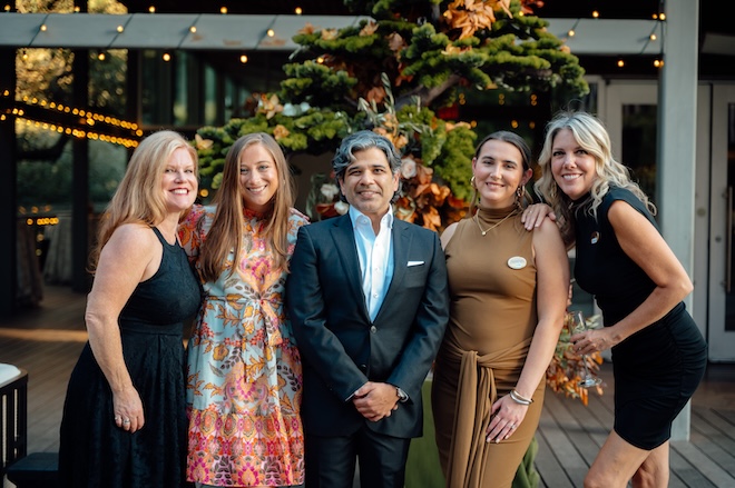 The Weddings in Houston team smiling for a picture at The Grove. 