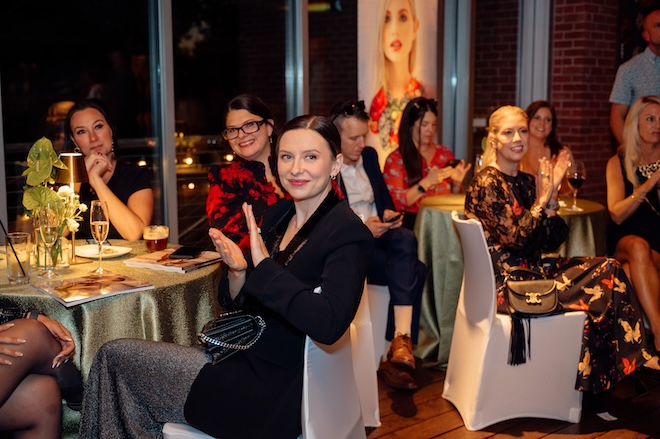 Guests clapping during our publisher's speech.