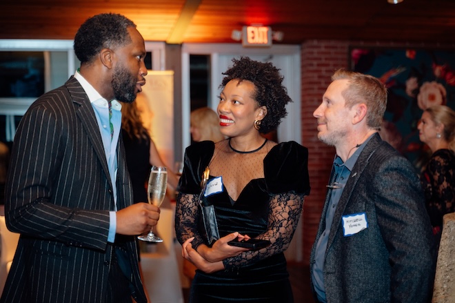 Guests mingling at the party. 
