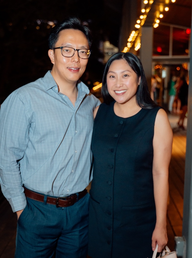 Guests posing for a photo at the Weddings in Houston client appreciation party.