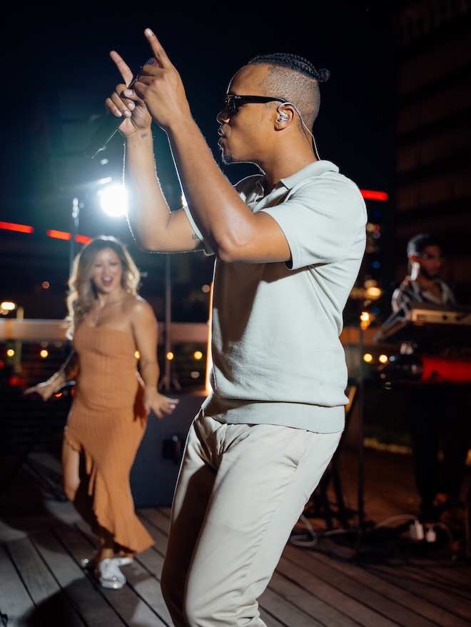 A singer of Hybrid 7 dancing while performing. 