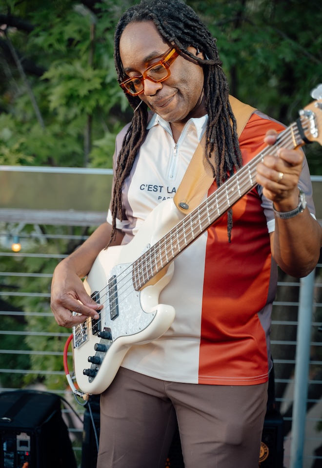 A band member of Hybrid 7 playing the electric guitar. 