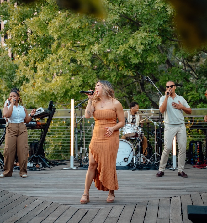 Hybrid 7 singing at the Weddings in Houston Client Appreciation Party. 