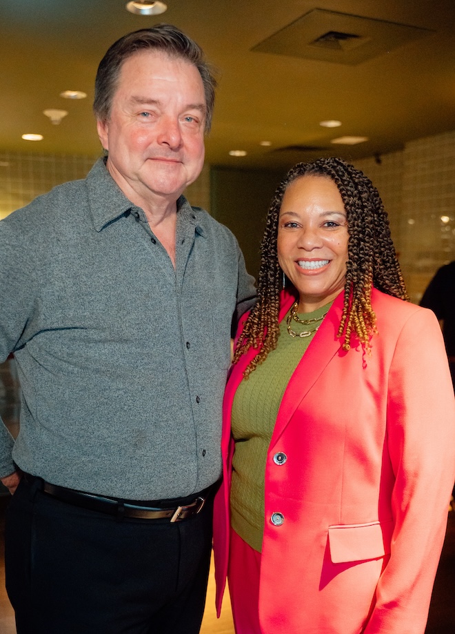 Guests posing for a photo at the Weddings in Houston client appreciation party.