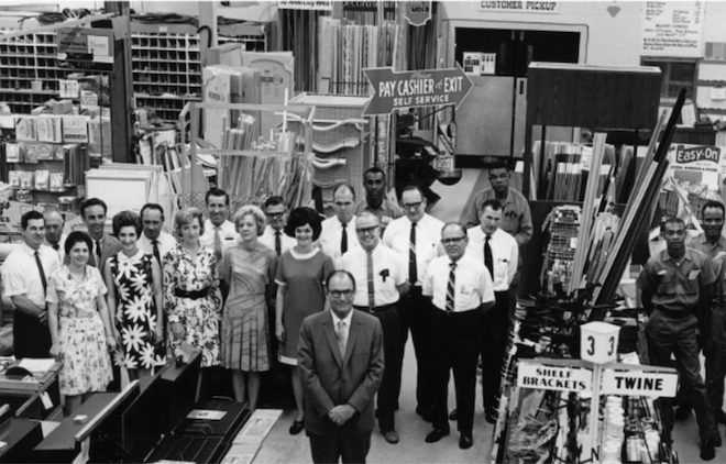 A historic photo of a group of people standing inside Bering's. 