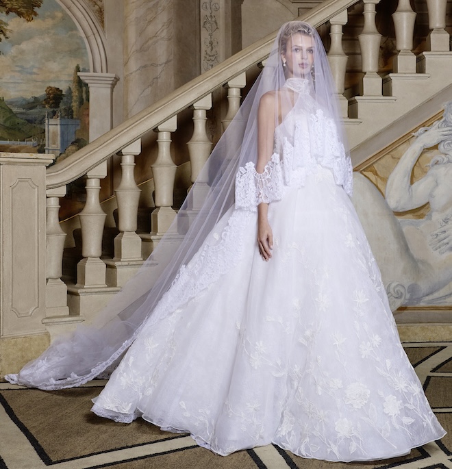 Bride wearing a blusher veil and a lace ballgown with a halter neckline. 