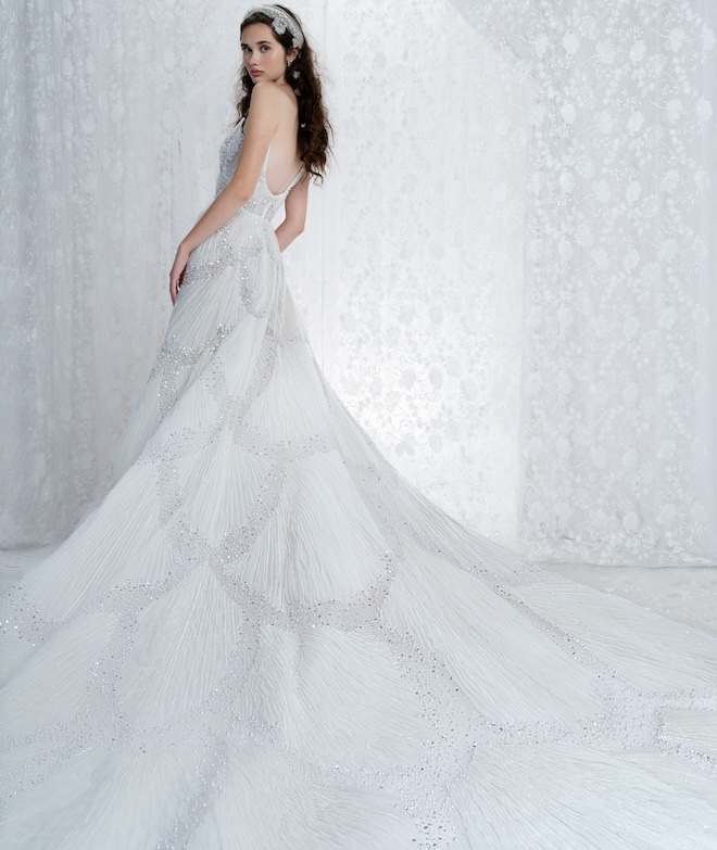 Bride wearing a Reem Acra textured gown with a beaded pattern. 