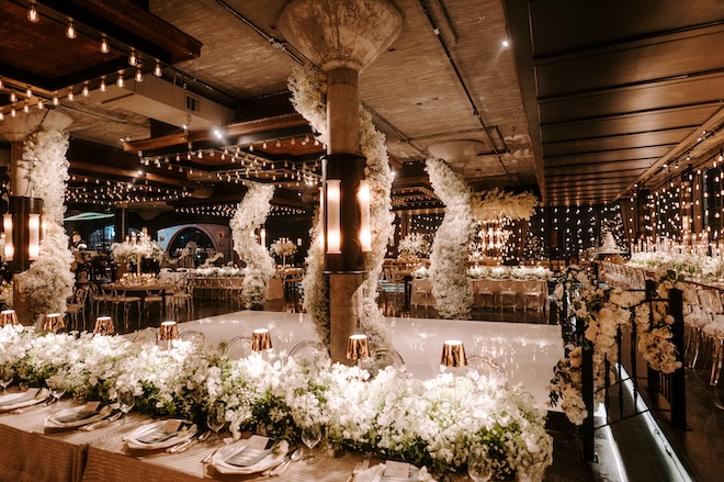 The Astorian decorated with baby's breath and twinkling lights for a moody wedding reception. 