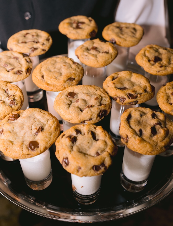 Milk and cookies are served at the wedding reception for a late-night wedding snacks.