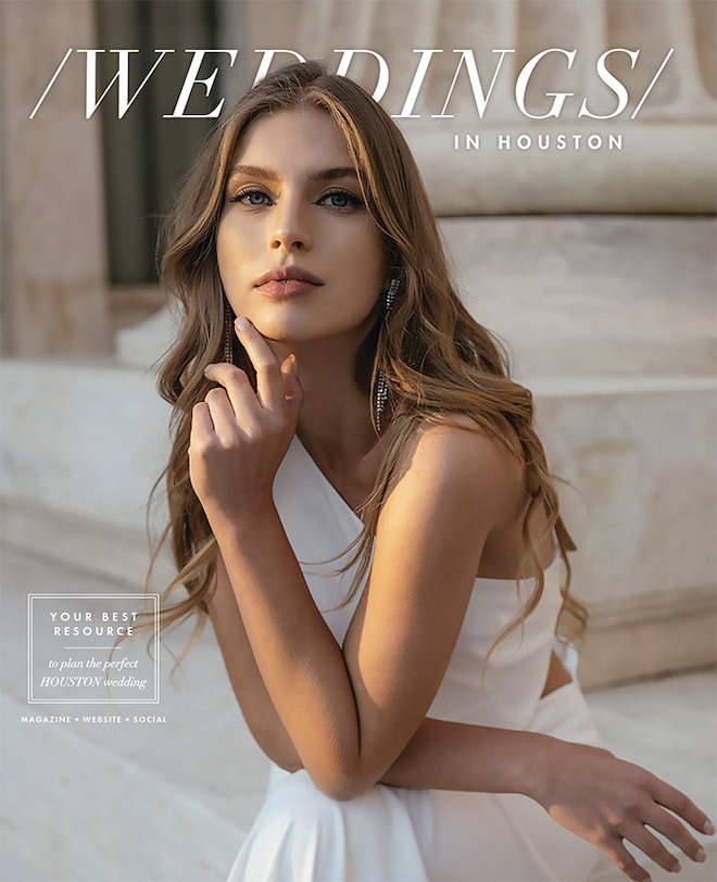 A golden hour sunset photo of a bride sitting on the steps of a building in Greece.
