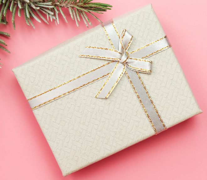 A present on a pink background. 