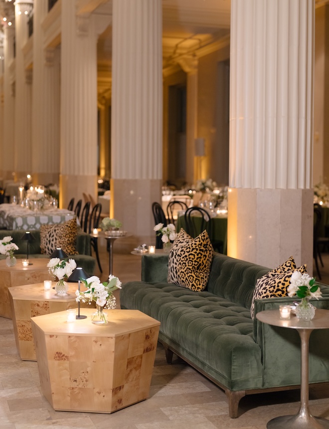 Green lounge furniture is placed around the dance floor at the wedding reception at the Corinthian Houston.