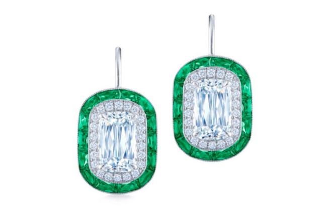 Diamond earrings with an emerald halo. 